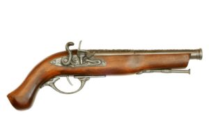 Antique flintlock pistol on white