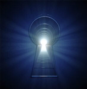 Glowing keyhole shaped door in blue light