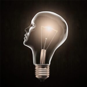 Light bulb shaped like a human head profile symbolising an idea