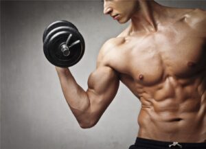 Muscular man lifting a dumbbell