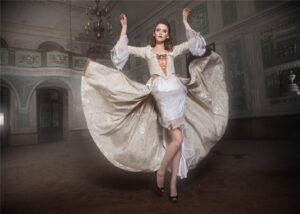 Woman in a flowing white dress dancing in a palace hall